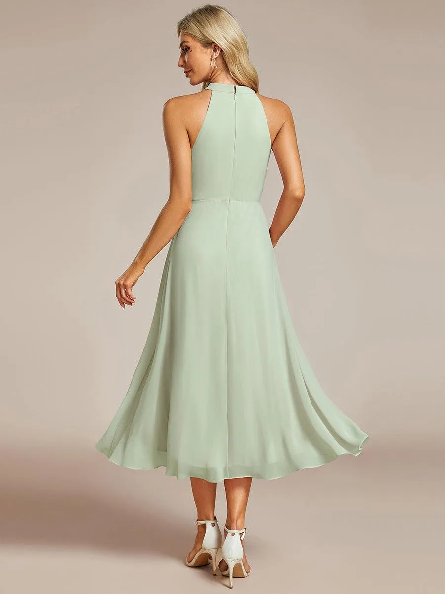 Robe d'invité de mariage mi-longue sans manches et col licou en mousseline de soie